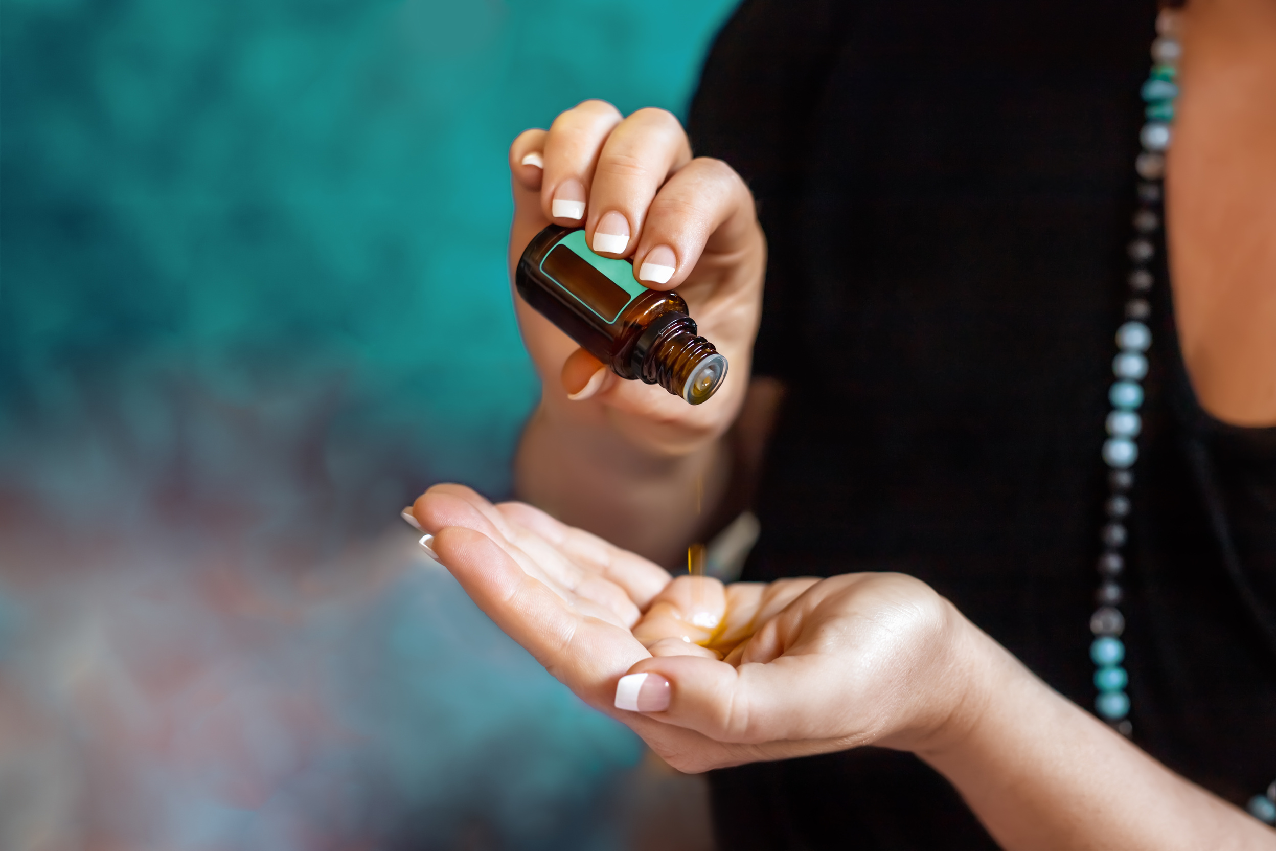 Womans hand with essential oil